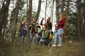 Image showing Group of friends on a camping or hiking trip in autumn day