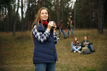 Image showing Group of friends on a camping or hiking trip in autumn day