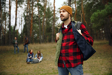 Image showing Group of friends on a camping or hiking trip in autumn day