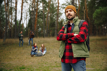 Image showing Group of friends on a camping or hiking trip in autumn day