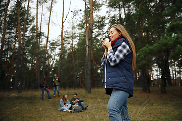 Image showing Group of friends on a camping or hiking trip in autumn day