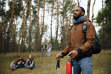 Image showing Group of friends on a camping or hiking trip in autumn day