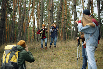 Image showing Group of friends on a camping or hiking trip in autumn day