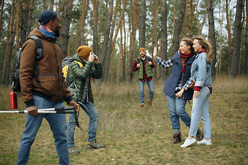 Image showing Group of friends on a camping or hiking trip in autumn day