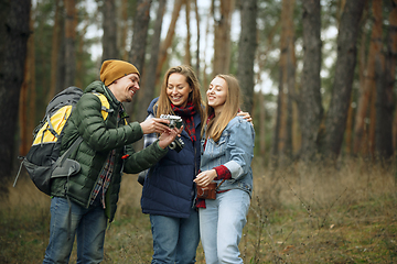 Image showing Group of friends on a camping or hiking trip in autumn day