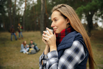 Image showing Group of friends on a camping or hiking trip in autumn day