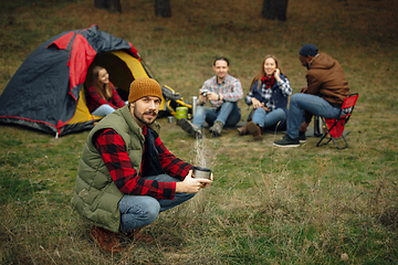 Image showing Group of friends on a camping or hiking trip in autumn day