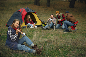 Image showing Group of friends on a camping or hiking trip in autumn day