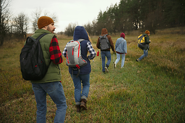 Image showing Group of friends on a camping or hiking trip in autumn day