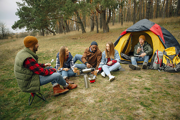 Image showing Group of friends on a camping or hiking trip in autumn day