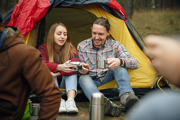 Image showing Group of friends on a camping or hiking trip in autumn day