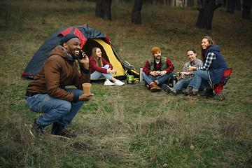 Image showing Group of friends on a camping or hiking trip in autumn day