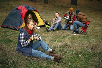 Image showing Group of friends on a camping or hiking trip in autumn day