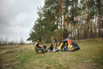 Image showing Group of friends on a camping or hiking trip in autumn day