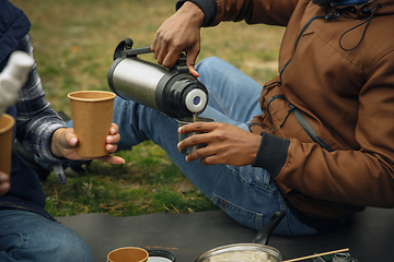 Image showing Group of friends on a camping or hiking trip in autumn day