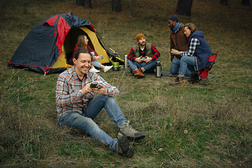 Image showing Group of friends on a camping or hiking trip in autumn day