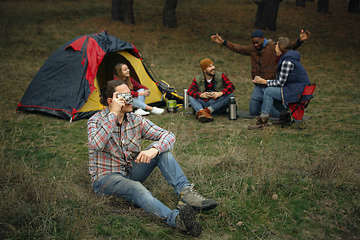 Image showing Group of friends on a camping or hiking trip in autumn day