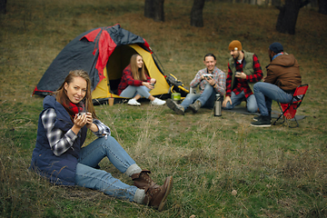 Image showing Group of friends on a camping or hiking trip in autumn day