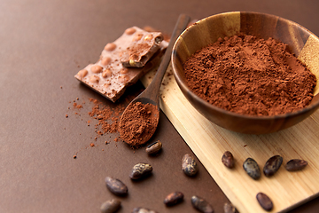 Image showing chocolate with hazelnuts, cocoa beans and powder