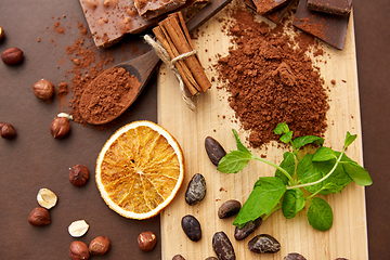 Image showing chocolate with hazelnuts, cocoa beans and powder