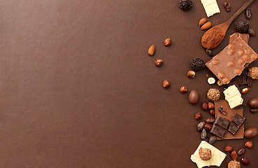 Image showing chocolate with nuts, cocoa beans and powder