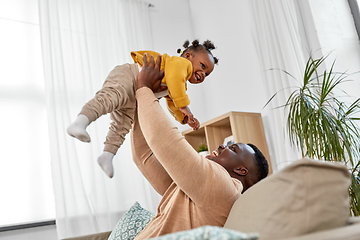 Image showing happy african american father with baby at home