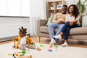Image showing african family with baby daughter playing at home