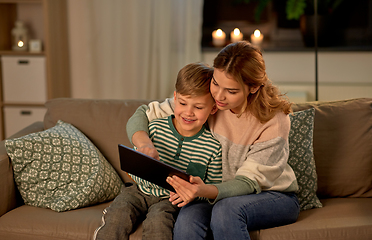 Image showing mother and son using tablet computer at home