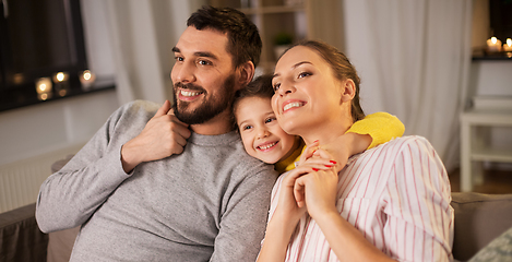 Image showing portrait of happy family sitting on sofa at home