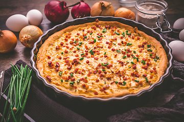 Image showing Homemade onion tart or pie with bacon and chives