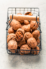 Image showing Organic walnuts in basket on kitchen table