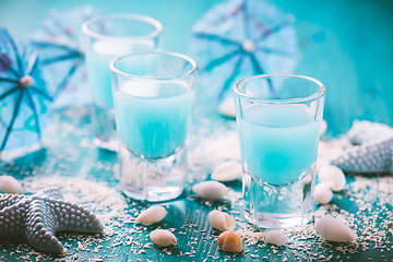 Image showing Blue shots for summer with seashells on blue background