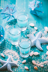 Image showing Blue shots for summer with seashells on blue background