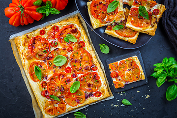 Image showing Vegetarian tomato tart or puffed pizza with herbs