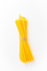 Image showing Spaghettini - thinner Spaghetti. Raw Spaghetti on white background 