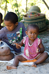 Image showing Countryside malagasy children from village sitting and resting i
