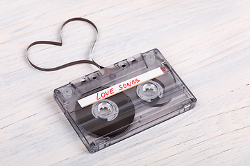 Image showing Audio cassette tape on wooden background. audio film shaping hea