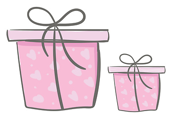 Image showing Two different present boxes of different shapes wrapped in pink 