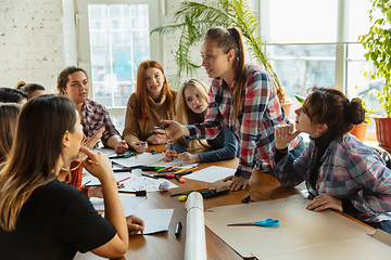 Image showing Young people discussing about women rights and equality at the office