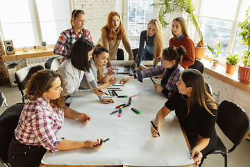 Image showing Young people discussing about women rights and equality at the office