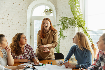 Image showing Young people discussing about women rights and equality at the office