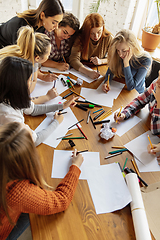 Image showing Young people discussing about women rights and equality at the office