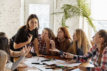 Image showing Young people discussing about women rights and equality at the office