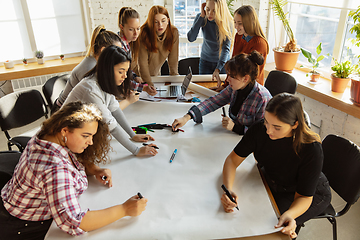 Image showing Young people discussing about women rights and equality at the office