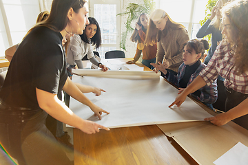 Image showing Young people discussing about women rights and equality at the office