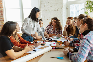 Image showing Young people discussing about women rights and equality at the office