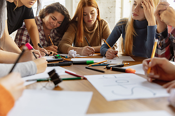 Image showing Young people discussing about women rights and equality at the office