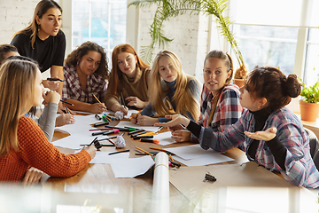 Image showing Young people discussing about women rights and equality at the office