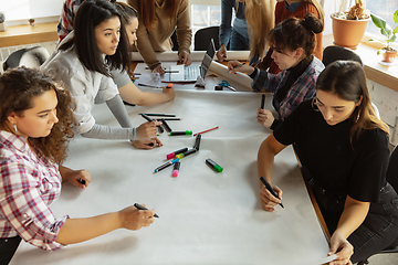 Image showing Young people discussing about women rights and equality at the office