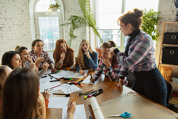 Image showing Young people discussing about women rights and equality at the office